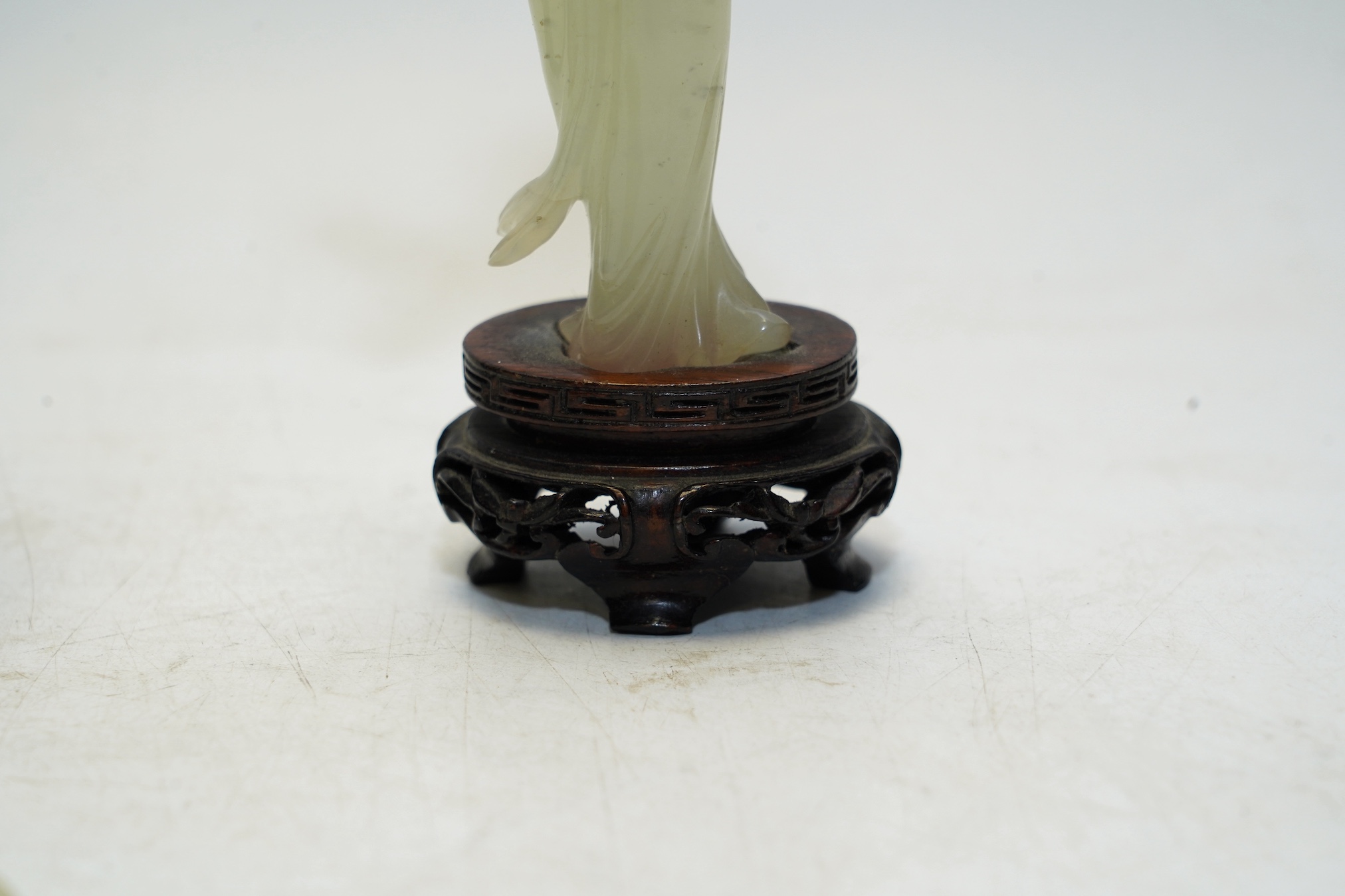 Four Chinese bowenite jade carvings, two on stands, largest 16cm high. Condition - fair to good, one figure with hand missing